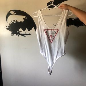 (Will be ironed upon purchase) GUESS staple, medium white bodysuit. Never worn.